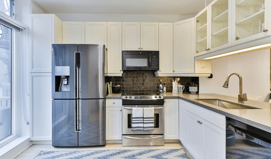Modern kitchen with stainless steel French door refrigerator