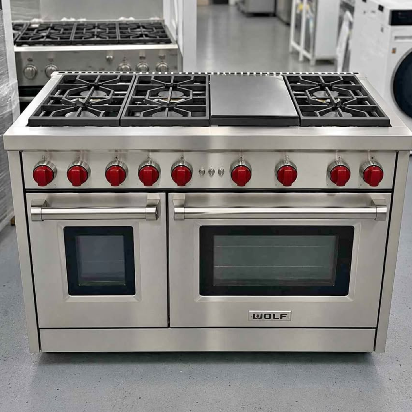 Brand new Wolf 48 inch professional gas range with griddle and red knobs, stainless steel, dual oven