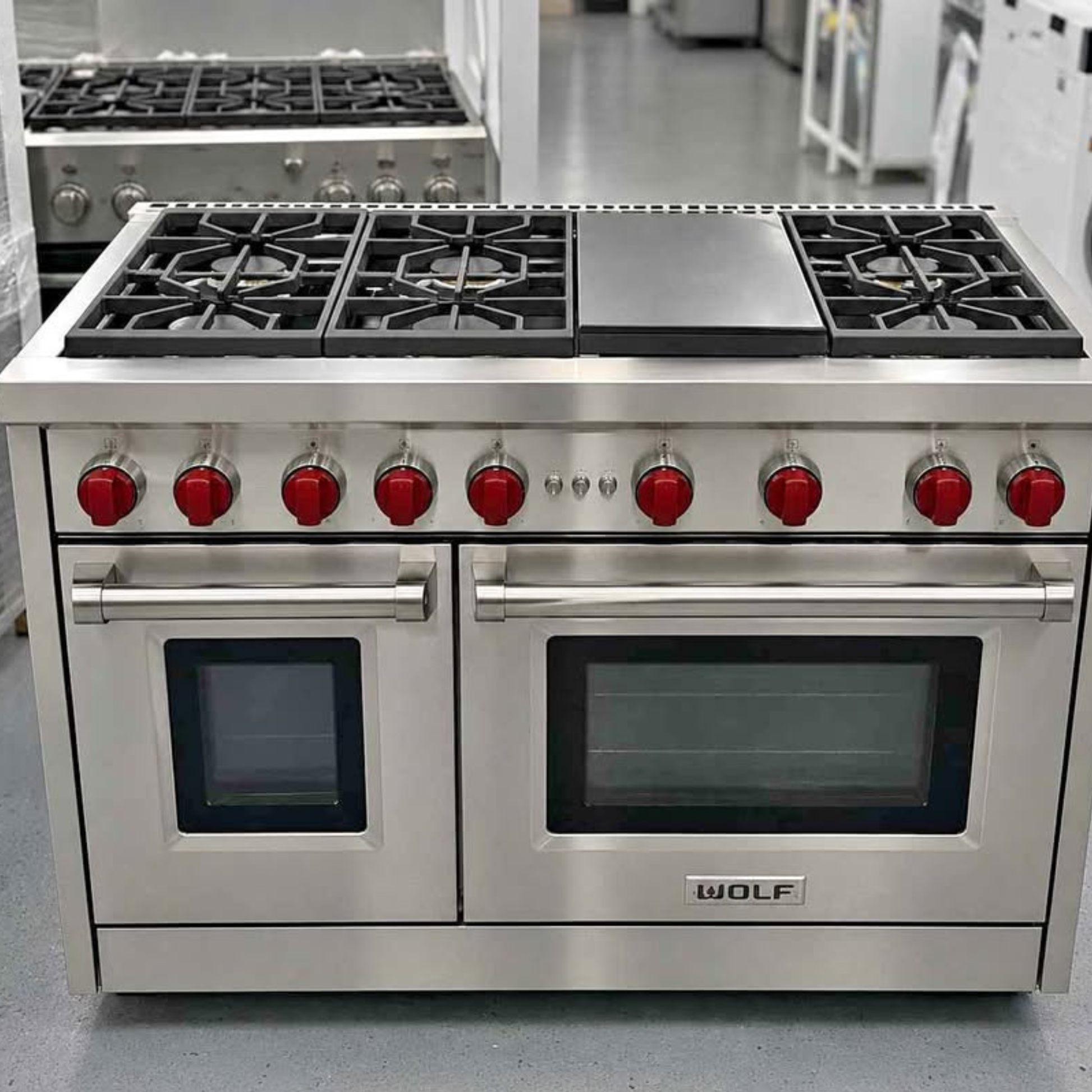 Brand new Wolf 48 inch professional gas range with griddle and red knobs, stainless steel, dual oven