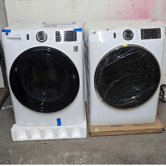 Brand new GE front load washer and dryer set, white, side by side view
